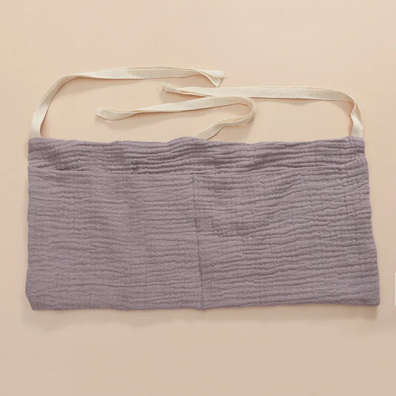 Organisateur de lit bébé multi-poches pour couches et accessoires