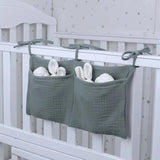 Organisateur de lit bébé multi-poches pour couches et accessoires