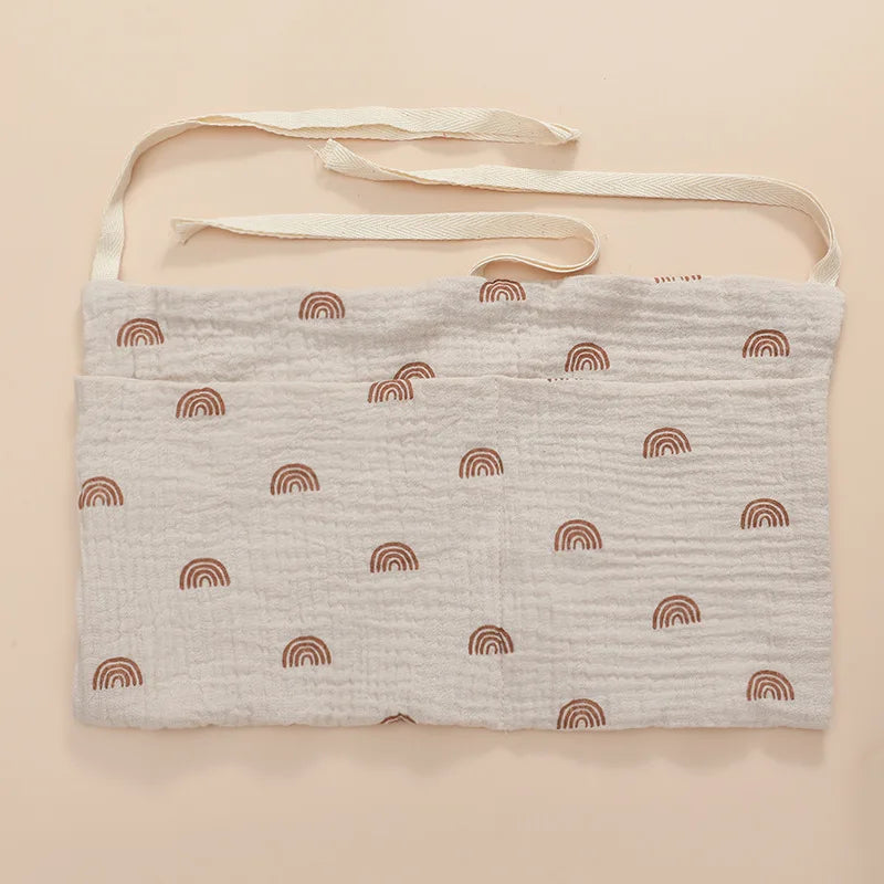 Organisateur de lit bébé multi-poches pour couches et accessoires