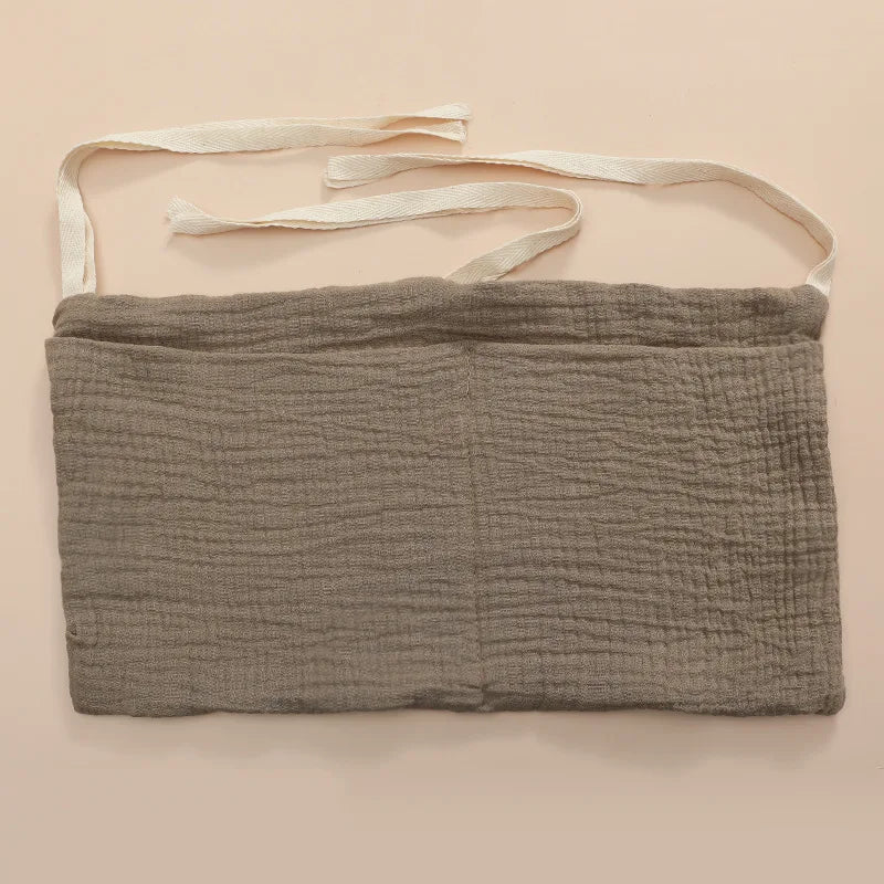 Organisateur de lit bébé multi-poches pour couches et accessoires