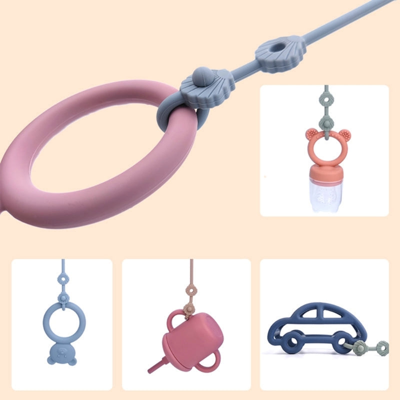 Attache-tétine silicone avec sangle de sécurité - accessoire poussette et chaise haute