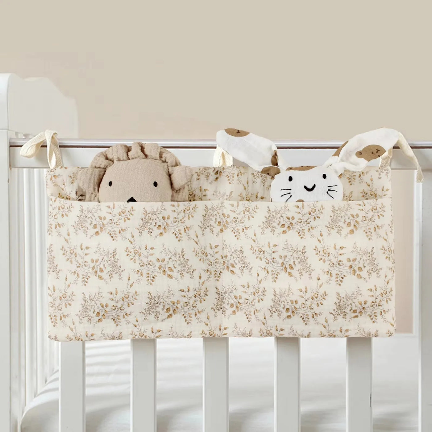 Organisateur de lit bébé multi-poches pour couches et accessoires