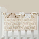 Organisateur de lit bébé multi-poches pour couches et accessoires