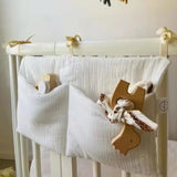 Organisateur de lit bébé multi-poches pour couches et accessoires