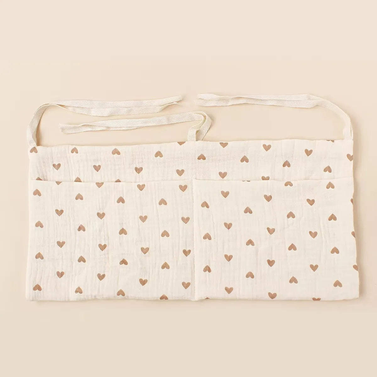 Organisateur de lit bébé multi-poches pour couches et accessoires